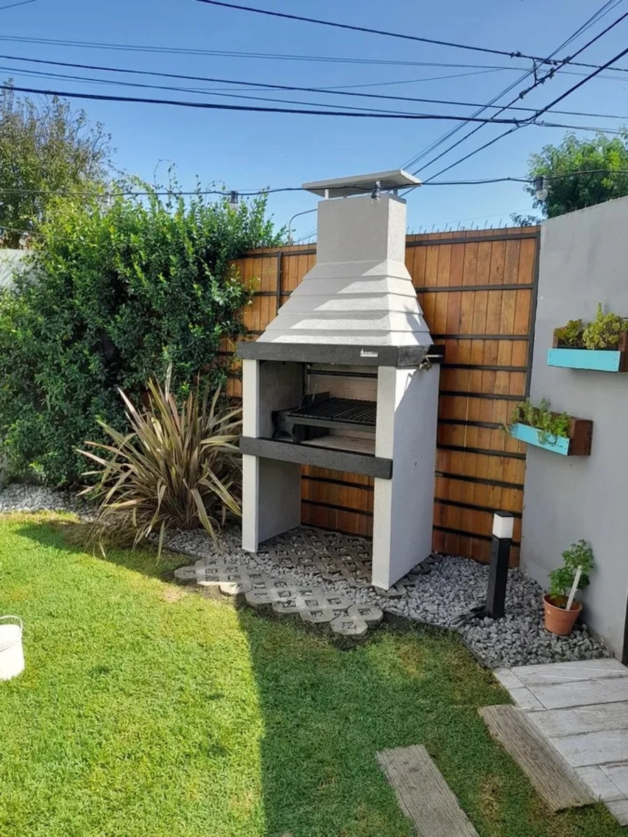 Argentine Grill ECO-02 in a backyard corner