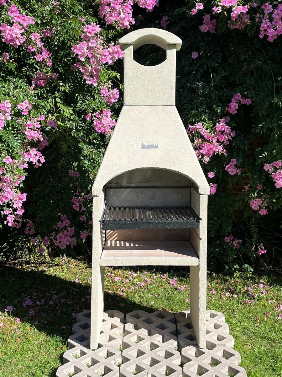 Argentine grill with hood in a garden