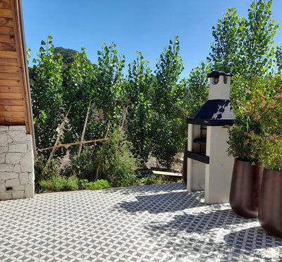 Argentine Grill ECO Mini on a tiled patio