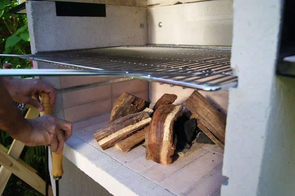 Firewood burning under the grill grate