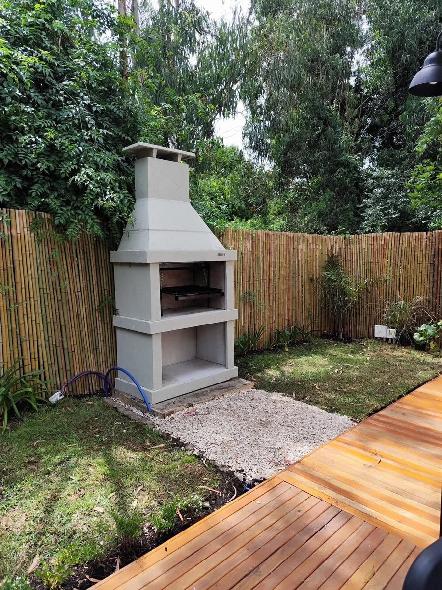 Argentine Grill N02 with fire space in a garden