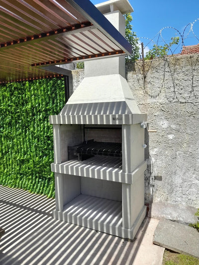 Argentine Grill N02 with fire space under a pergola
